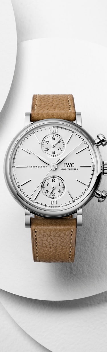 Man wearing IWC Portofino Chronograph with silver plated dial, stainless steel case and black alligator leather strap.