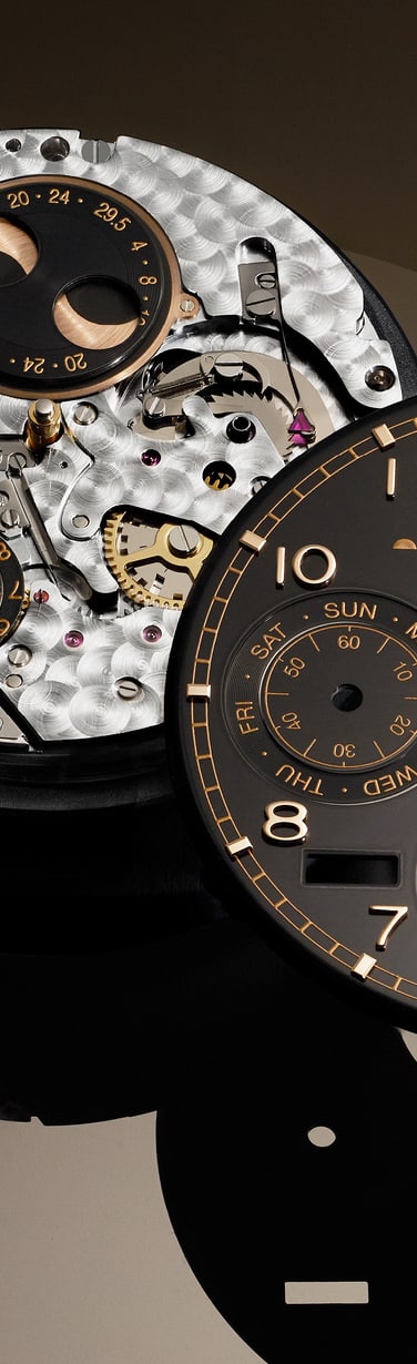 Close up on hands putting black dial of IWC Portugieser Perpetual Calendar on its mechanism