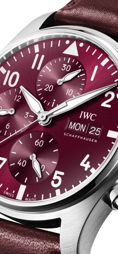 Pilot’s Watch Chronograph Edition “Chinese New Year” watch with burgundy dial and strap against white background