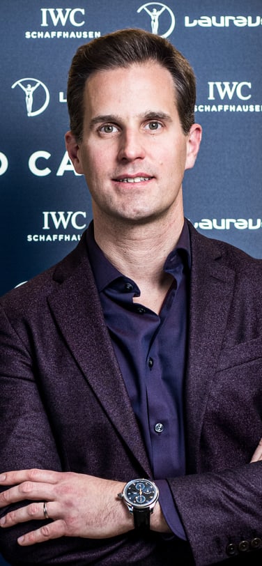 IWC CEO Chris Grainger-Herr next to one of the Academy members.