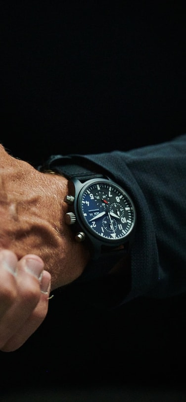 Close up of a man's wrist wearing an IWC watch