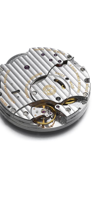Image showing a disassembled IWC watch on white background