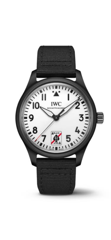 Pilot's Watch Automatic 41 Black Aces laying on a dark surface, black dial, black fabric strap and white dial with black lettering