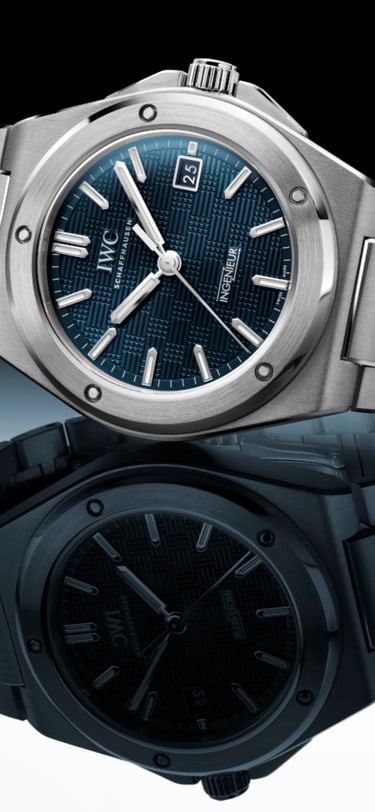 Ingenieur Automatic watch with blue dial and stainless steel bracelet lying on a reflective surface