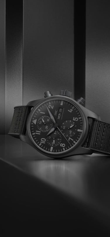 Pilot's watch chronograph 41 Top Gun Ceratanium IW388106 in the forground in front of dark background
