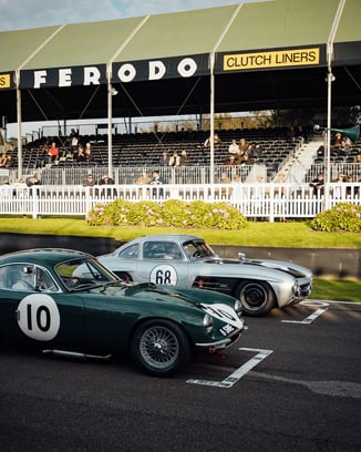 Two vintage cars at the Goodwood Festival of Speed.